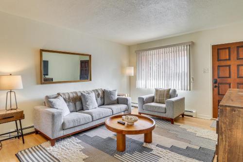 a living room with a couch and a table at 2 Mi to UNM Campus Home in Quiet Area of ABQ in Albuquerque