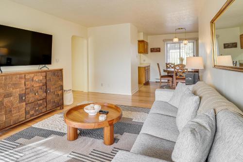 a living room with a couch and a coffee table at 2 Mi to UNM Campus Home in Quiet Area of ABQ in Albuquerque