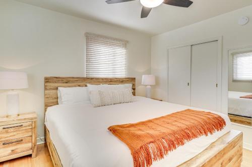 a bedroom with a large bed and a ceiling fan at 2 Mi to UNM Campus Home in Quiet Area of ABQ in Albuquerque