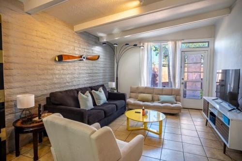 a living room with a couch and a table at Msg for 5percent off 2Bed1and a half Bath KingQueenBeds CondoPHX in Phoenix