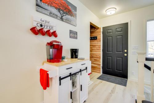 a kitchen with red boots on the wall at 2 Mi to Lake Michigan Family-Friendly Home in Manitowoc