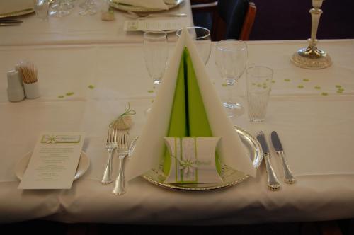 a table with a plate with a napkin on top of it at Hotel Balka Strand in Neksø
