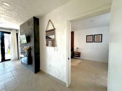 a hallway of a home with white walls at Casa Madera 1B in Zacatlán