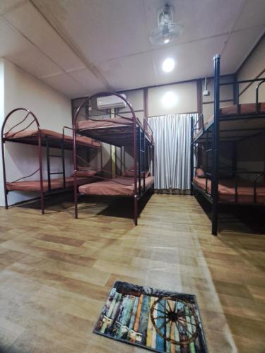 Postel nebo postele na pokoji v ubytování Benteng Taman Negara