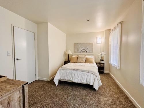 a bedroom with a large bed in a room at Downtown 2BR Penthouse Suite with Balcony and Direct Skybridge Access in Indianapolis