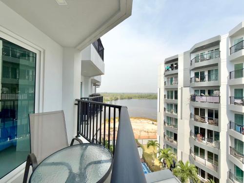 an apartment balcony with a view of the water at Mantra Beach Condominium Suite - Mae Phim in Ban Tha Fat