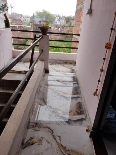 a view from the balcony of a house with water on the floor at Arshu apartment in Prayagraj