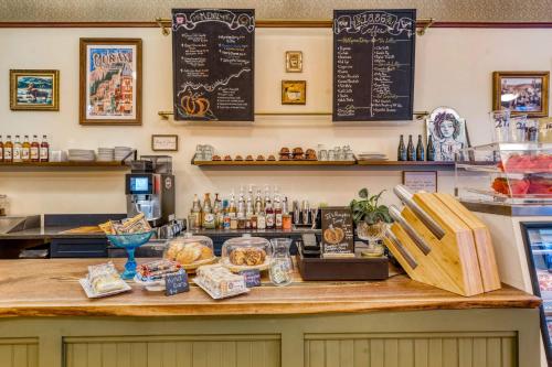 a counter at a restaurant with food on it at Beaumont Hotel and Spa - Adults Only in Ouray