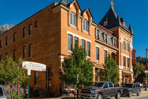 a truck parked in front of a brick building at Beaumont Hotel and Spa - Adults Only in Ouray