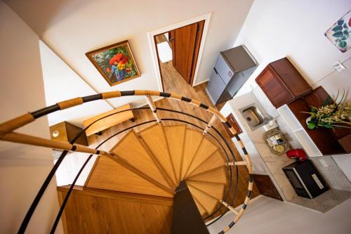 an overhead view of a spiral staircase in a house at Le-Mao Chiang Dao in Chiang Dao