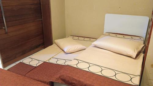 Giường trong phòng chung tại House Medeiros