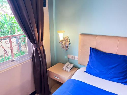 Кровать или кровати в номере Ceria Boutique Hotel