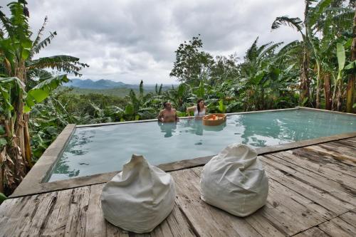Bazén v ubytování Kalikasan Glamping Resort near Manila with Overlooking Pool and Starlink nebo v jeho okolí
