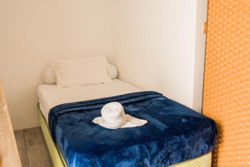 Postel nebo postele na pokoji v ubytování Long Beach Laamu Hotel