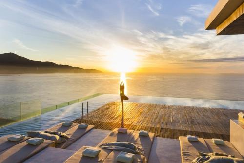 a view of the ocean from the deck of a house at Stunning Apartments Across My Khe Beach ! Rooftop Pool & Gym in Da Nang
