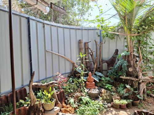 a garden with a bunch of plants and trees at Sadhana on the beach in Alleppey