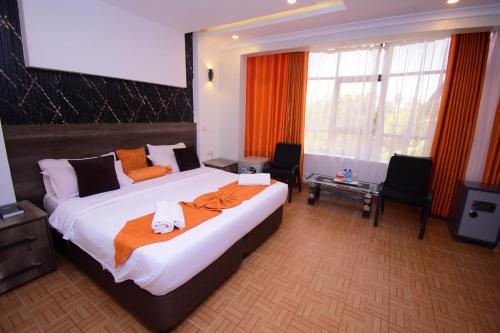 Postel nebo postele na pokoji v ubytování Sunstar Hotel Nairobi