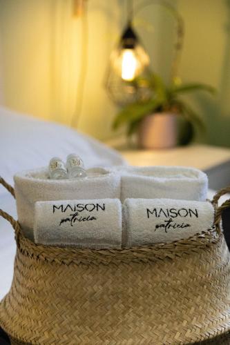 a pile of towels sitting on top of a basket at Maison Patricia in Lecce