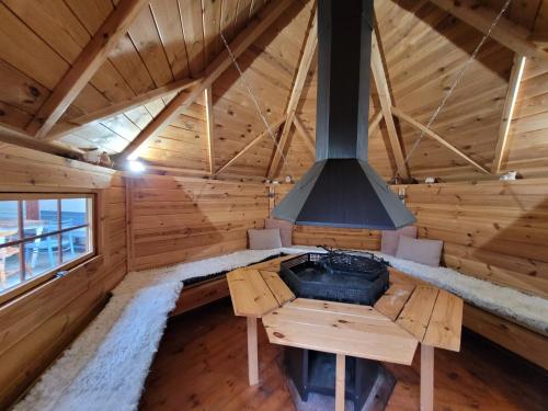 an inside view of a stove in a log cabin at Apartmán Maya in Horní Planá