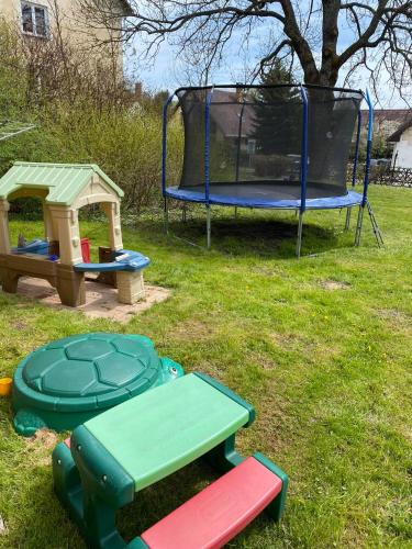 a playground with a trampoline and a play set at Apartmán Maya in Horní Planá