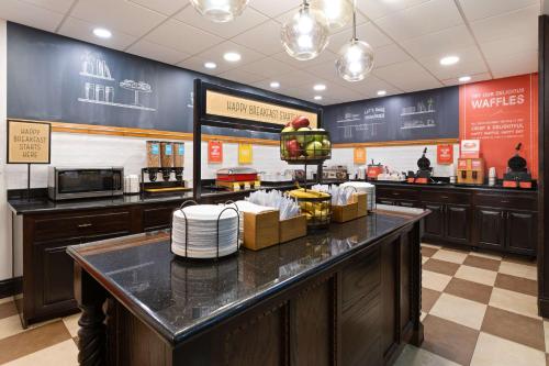 a fast food restaurant with a counter with food at Hampton Inn & Suites Wells-Ogunquit in Wells