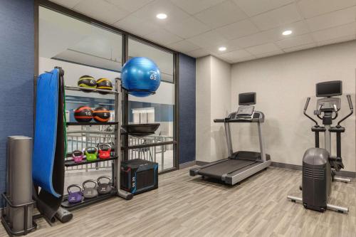 a fitness room with a treadmill and a gym at Hampton Inn Waynesboro/Stuarts Draft in Fishersville