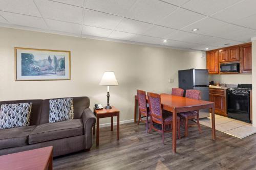 a living room with a couch and a table at Quality Inn & Suites Green Bay Downtown in Green Bay