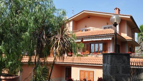a large house with trees in front of it at Bed and Lemons in Piano di Sorrento
