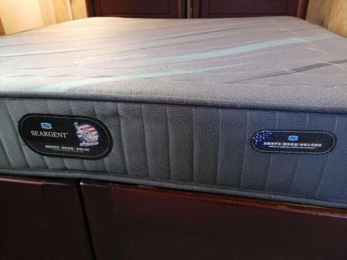 a mattress sitting on top of a bed at ShuYa Hotel 舒雅酒店 in Luang Prabang