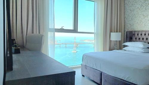 a hotel room with a bed and a large window at Full Seaview & Louvre Museum 1BHK - Al Reem Island in Abu Dhabi