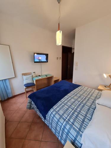 Postel nebo postele na pokoji v ubytování Albergo Genio