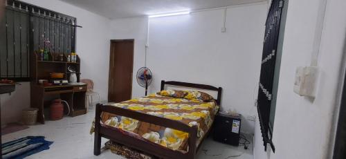 a bedroom with a bed in a room at The guest house in Port Louis