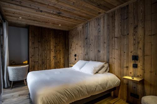 Postel nebo postele na pokoji v ubytování Chalet Prestige Valmorel