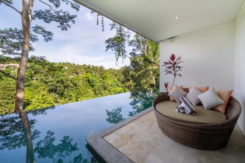 a room with a view of the water at The Hidden Paradise Ubud - CHSE Certified in Ubud