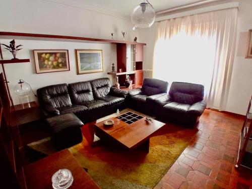 a living room with a couch and a coffee table at Big apartment between Bologna and Florence in Mercatale Vernio