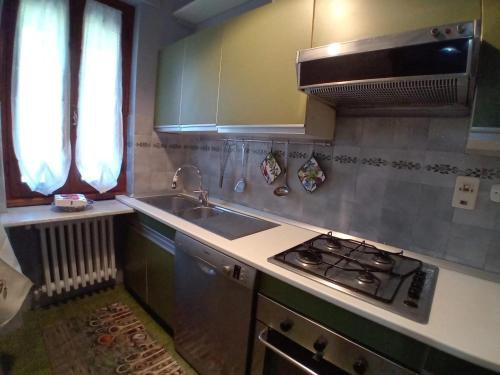 a kitchen with a sink and a stove top oven at Big apartment between Bologna and Florence in Mercatale Vernio