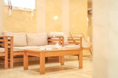 a living room with a couch and a coffee table at СПА-Готель "RESPECT" in Skhidnitsa