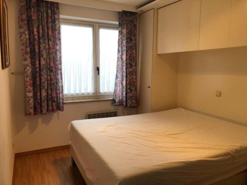 Postel nebo postele na pokoji v ubytování Zeedijk Koksijde