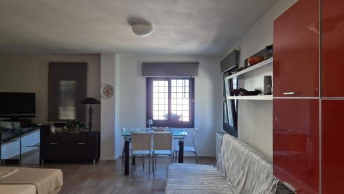 a living room with a table and a dining room at Villas On The Rock Afissos in Afissos