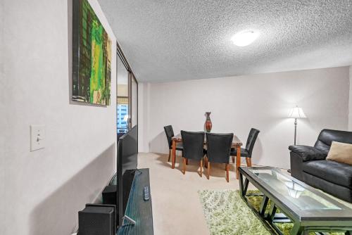 a living room with a couch and a table at Chic DT Honolulu Executive Condo condo in Honolulu