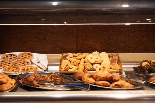 a buffet of different types of food on a table at Dado Hotel International in Parma