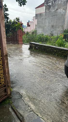 a flooded street with water on the ground at Neupane's Homestay in Kathmandu