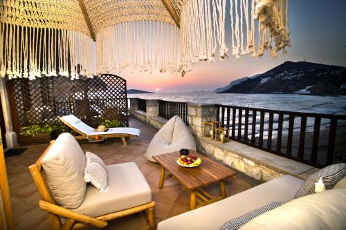 a balcony with a view of the ocean at Kantouni Bay Suites in Kalymnos