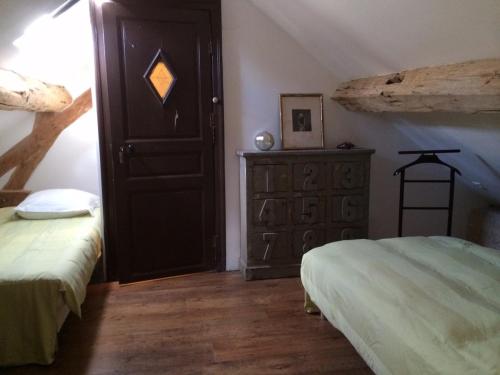 Gîte de l'Orangerie du Saulceにあるベッド