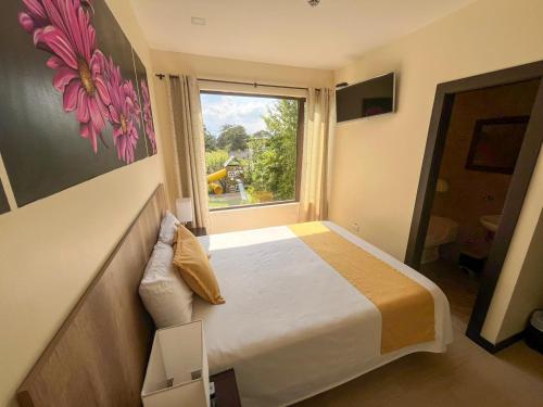 Postel nebo postele na pokoji v ubytování Hotel Las Mercedes Airport-Quito