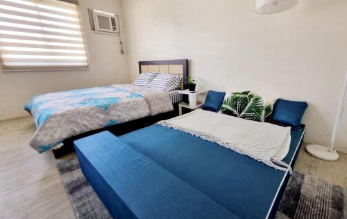 Ένα ή περισσότερα κρεβάτια σε δωμάτιο στο Joms Minimalist Crib Nuvali