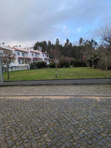 a cobblestone street in front of a building at Leiria Tranquil Hideaway in Leiria