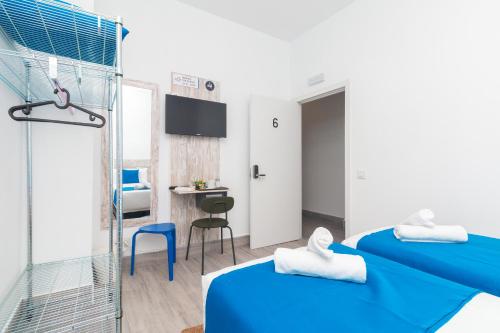 Postel nebo postele na pokoji v ubytování Moreno Rooms