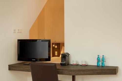 TV o dispositivi per l'intrattenimento presso H+ Hotel Nürnberg