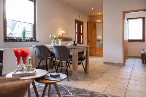 a living room with a table and chairs at FeWo Severin in Bottrop